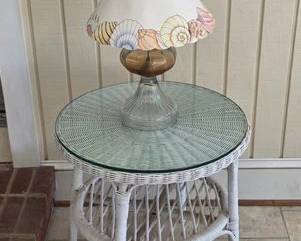 Wicker glass top table and oil lamp