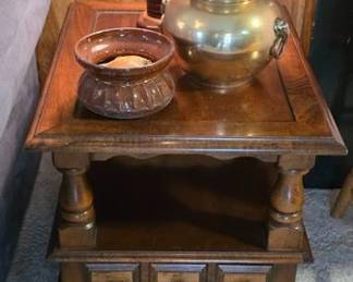 Crockery and brass spittoons on vintage chunky wood style side table