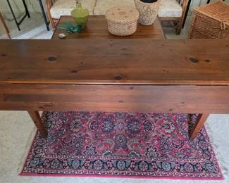 Persian rug under a farm-style drop leaf table
