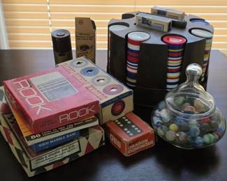 Vintage games, poker chips and jar of marbles