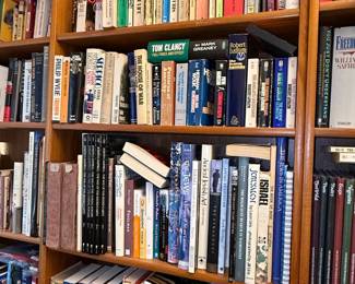 Collection of Assorted Books - Including Authors like Tom Clancy, Robert Ludlum, Leon Uris, Joseph Conrad, and Mark Greaney