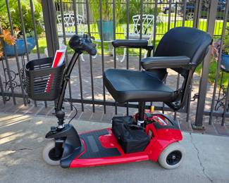 Mobility aides, including this Pride Travel Pro scooter