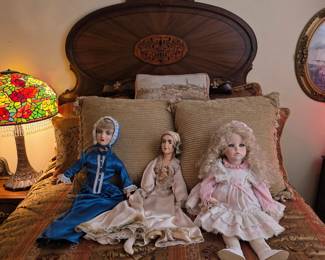 A selection of antique and vintage dolls is present throughout the estate.