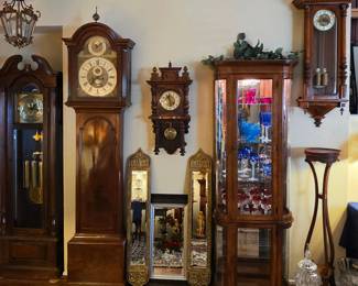 Timepieces, cabinets, and layered furnishings create depth well beyond a single category.