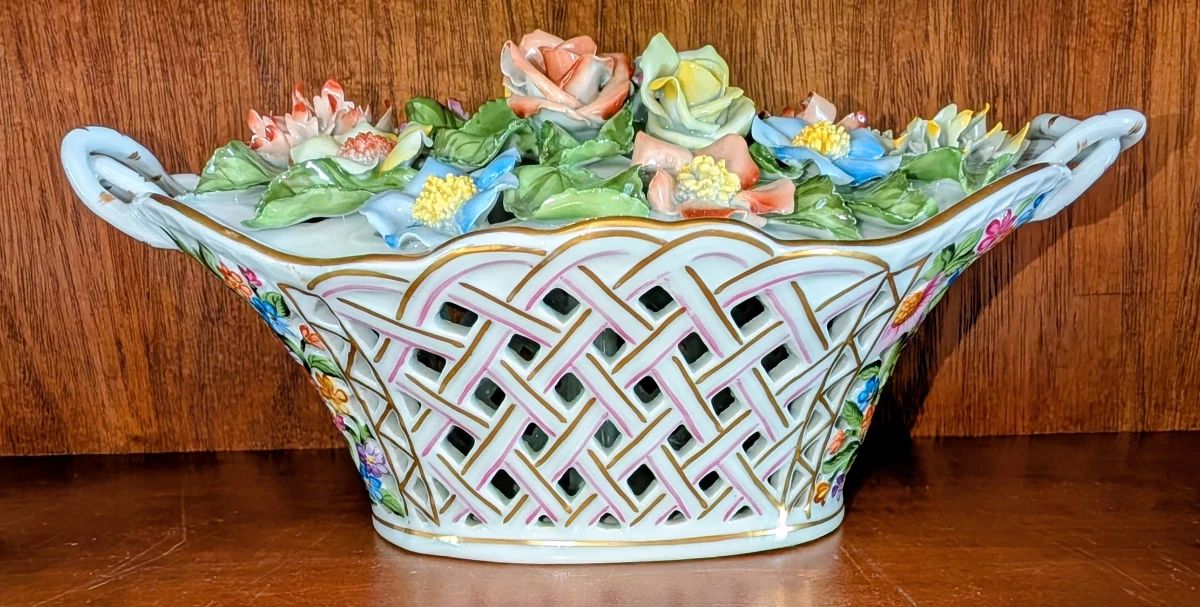 Heron Queen Victoria bouquet exquisitely detailed petals and a braided handled basket