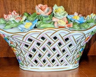 Heron Queen Victoria bouquet exquisitely detailed petals and a braided handled basket