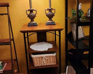 Pair of tall, urn style lamps on sturdy, wood and metal shelving, sewing basket, lined basket, child's rocker