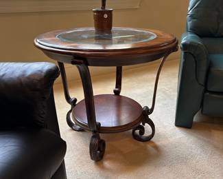 R30 - $40. Round Side Table with Iron Base, wood & glass top.  Measures 28" across x 24" tall. 