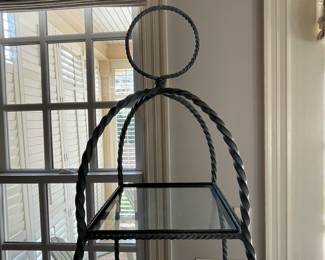 R93 - $250. Regency Twisted Metal Rope Iron & Glass Etagere. Measures 18" square x 79" tall. 