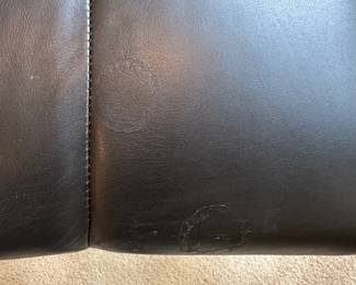 R28 -$150. Black Rocking Recliner from La-Z-Boy. Measures 34" wide x 38" tall.  Rocks until you put the foot rest out and then it locks for a nap! Soft leather - very gently used. Headrest is not stained. 