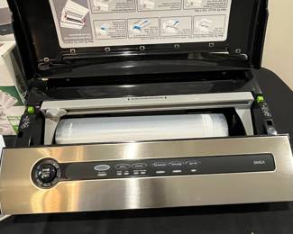 R61 - $75. Food Saver 3800 Series with box of new bag rolls. 