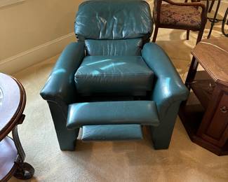 R29 - $50. Green Leather Push Back Recliner. Measures 33" wide x 37" tall. Leather is in very good condition. Chair is a bit wiggly but overall good condition with lots of life left!