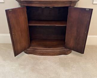 R12 - $40. Brandt Cabinet. Antique Cherry Finish. Measures 33" x 13" x 29" tall. 