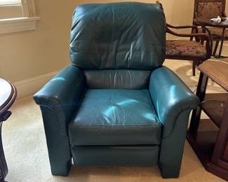 R29 - $50. Green Leather Push Back Recliner. Measures 33" wide x 37" tall. Leather is in very good condition. Chair is a bit wiggly but overall good condition with lots of life left!