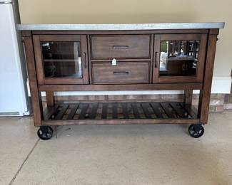 R36 - $250.  Bayside Kitchen Island - on wheels. Measures 60" x 20" x 38" tall. Very good, gently used condition! Minor scuffing on shelves and bottom. Doors on both sides - lots of storage. 