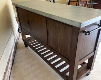 R36 - $250.  Bayside Kitchen Island - on wheels. Measures 60" x 20" x 38" tall. Very good, gently used condition! Minor scuffing on shelves and bottom. Doors on both sides - lots of storage. 