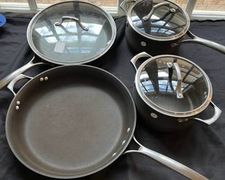 R91 - $50. Set of Calphalon Unison Pot and Pan Set. 2qt and 5qt Pots w/lids. 10" Pan w/lid. 14" Pan No lid.