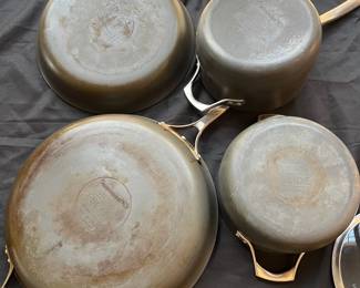 R91 - $50. Set of Calphalon Unison Pot and Pan Set. 2qt and 5qt Pots w/lids. 10" Pan w/lid. 14" Pan No lid.