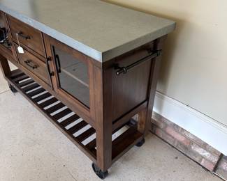 R36 - $250.  Bayside Kitchen Island - on wheels. Measures 60" x 20" x 38" tall. Very good, gently used condition! Minor scuffing on shelves and bottom. Doors on both sides - lots of storage. 