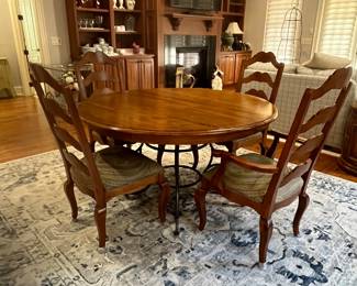 R114 - $450. Ethan Allen Table & Chairs. Measures 56" round x 30" tall. Has 1 leaf that adds 20". Table is very sturdy and in very good condition. Chairs have been heavily used and need reupholstered / tightened up. 