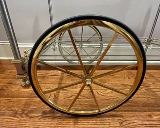R82 - $450. French Bar Cart. Brass & Glass with finials. Rolls easily! Measures 36" x 20" x 33" tall. 