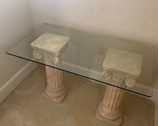 R7 - $45. Glass Top Table with Plaster Columns. Measures 44" x 24" x 29" tall. Minor chipping on plaster - glass is in great condition!