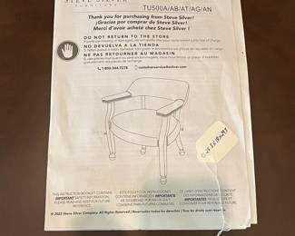 R103 - $65. Steve Silver Furniture - Rolling Captains Chair.  Measures 25.5" x 18" x 29.5" tall. Very gently used in excellent condition. 