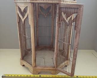 R115 - $50. Large Decorative Birdcage. Wood and Wire. Measures 21" d x 36.5" tall.
