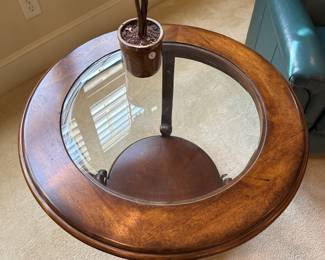 R30 - $40. Round Side Table with Iron Base, wood & glass top.  Measures 28" across x 24" tall. 