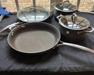 R91 - $50. Set of Calphalon Unison Pot and Pan Set. 2qt and 5qt Pots w/lids. 10" Pan w/lid. 14" Pan No lid.