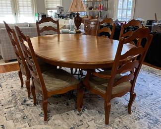 R114 - $450. Ethan Allen Table & Chairs. Measures 56" round x 30" tall. Has 1 leaf that adds 20". Table is very sturdy and in very good condition. Chairs have been heavily used and need reupholstered / tightened up. 