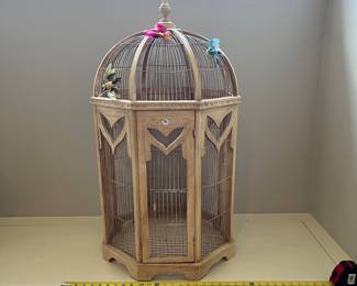R115 - $50. Large Decorative Birdcage. Wood and Wire. Measures 21" d x 36.5" tall.