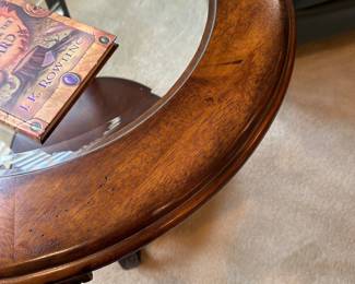 R30 - $40. Round Side Table with Iron Base, wood & glass top.  Measures 28" across x 24" tall. 