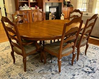 R114 - $450. Ethan Allen Table & Chairs. Measures 56" round x 30" tall. Has 1 leaf that adds 20". Table is very sturdy and in very good condition. Chairs have been heavily used and need reupholstered / tightened up. 