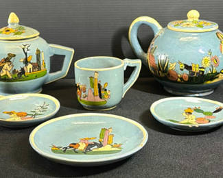 Lot 412: Teal-blue glazed ceramic tea service with hand-painted figures and cactus motifs