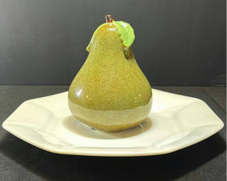 Lot 405: Ceramic pear-shaped figurine on white plate