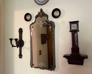 Bronze Classical torch light sconce/ Vtg mirror/ Mariana foster prints/ Bombay clock 