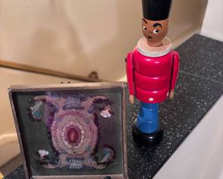 Reverse painted glass plaque ( Robert Weiss)  & vintage stacking toy soldier 