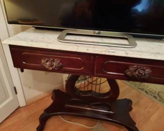 All marble on tables made in Italy. The bases mahogony stained wood from Pennsylvania