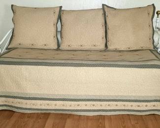 Daybed pops up to make a queensize bed. Comes with extra pillows