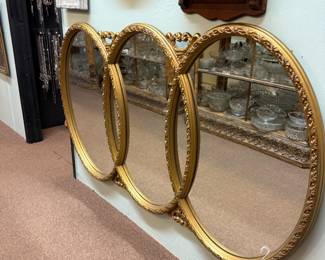 pretty, large gold tone triple oval mirror