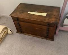 Trunk full of antique clock parts