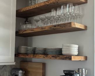 Glassware, china and espresso machine. Art work on top shelf not included in sale.