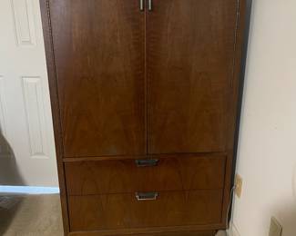 D25 - $400. Stanley bedroom set. Queen size bed, side table, tall, dresser, short dresser with two wall hanging mirrors. Bedside table measures 25” wide x 16” deep x 21.75” tall. Top is worn. Veneer chipped on the bottom.  Tall dresser measures 36” wide x 18.5” deep x 54” tall. Four drawers and three cubbies. Wear on doors from use.  Queen size headboard 49” tall. Mattress was used with a cover on it. Frame is on wheels. Frame is attached to the headboard. Long dresser measures 74” wide x 18.5” deep x 29.5 inches tall. Nine drawers. Some wear and veneer chipped off. Solid construction. Two mirrors measure 19“ wide x 45“ tall. 