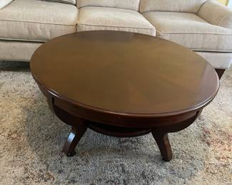 D7 - $125. Haverty’s coffee table. Very solid and sturdy. Measures 40” diameter x 19” tall. Matching end tables also available. 