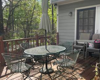 D34 - $150. Patio table and 4 chairs with umbrella stand. Umbrella may need to be replaced. Metal/iron painted green. Solid and sturdy. Table measures 58” wide x 38” deep x 27” tall. 
