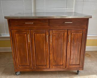 D16 - $150. Home Styles Rolling Kitchen Cart with storage and a drop leaf. Measures 43” wide x 20” deep x 35” tall. 30” deep with extension up.  Needs a little cleaning but very good condition!