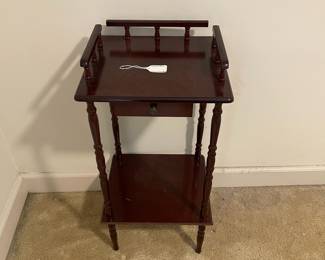 D12 - $50.  Vintage Telephone Table with small drawer and shelf. Measures 13.5” wide x 1.5” deep x 28” tall. 
