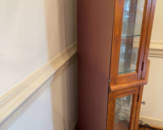 D2 - $150. Giuseppe Arcase English Oak Corner Curio Cabinet. Lighted. Measures 32” w 23” d 73” t. 