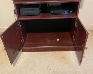 D9 - $35. Pressboard tv stand. Measures 24” wide x 19” deep x 28” tall. 
